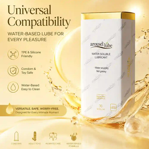A box of arousellube water soluble lubricant stands on a gold-toned background with liquid splash graphics. The package is white with a metallic gold top and gold text.