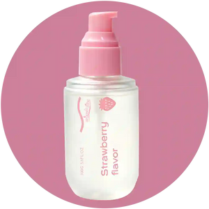 A clear plastic pump bottle of facial cleanser with a pink pump dispenser, labeled 'Strawberry flavor' by the brand 'natural life', centered on a pink circular background.