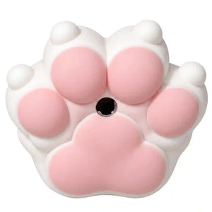 A pink and white cat paw-shaped object with five soft pads and a small black circular center, shown on a plain white background.