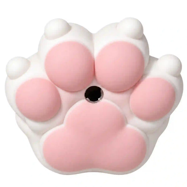 A pink and white cat paw-shaped object with five soft pads and a small black circular center, shown on a plain white background.