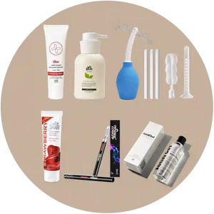 Collection of various personal care products on a beige background