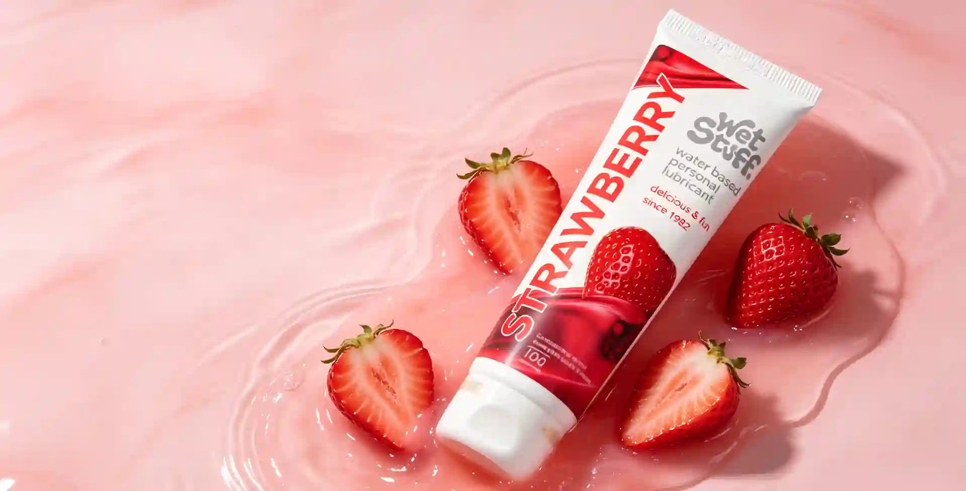 vaginal intercourse virgin girl insemination lube Strawberry-flavored product with strawberries on a pink background