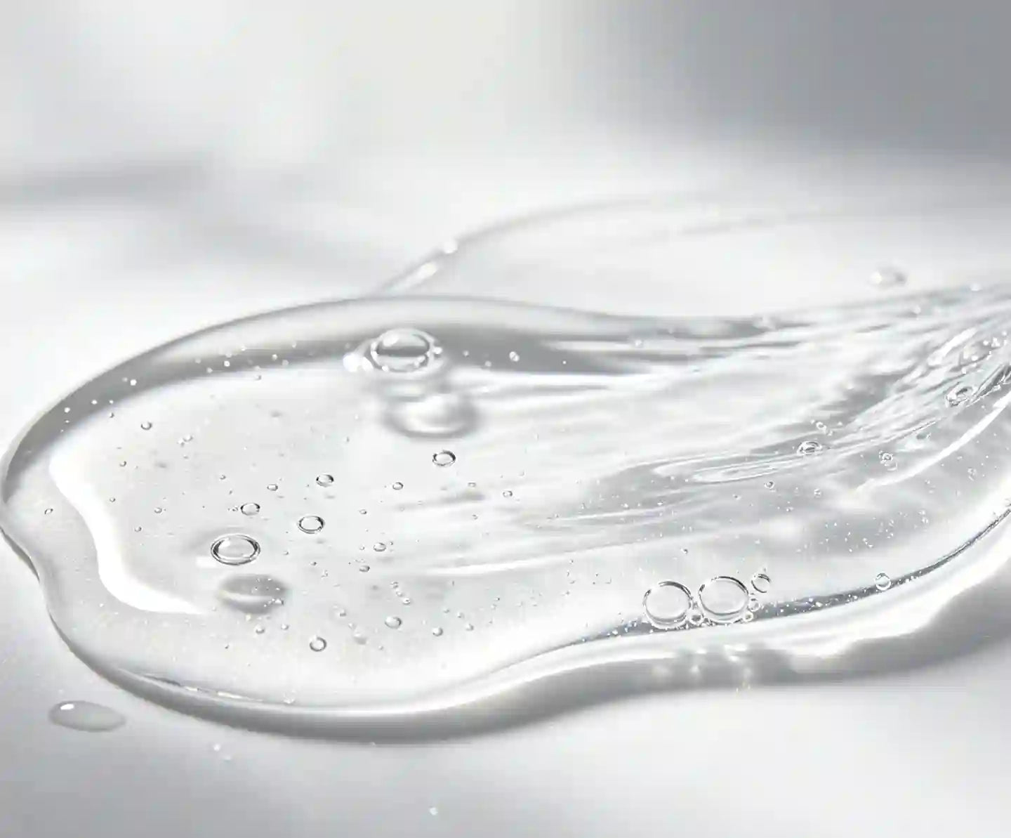 Close-up of water droplets on a reflective surface edible 
fornication lube 