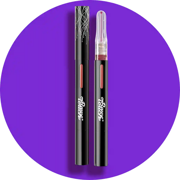Two black clutoris and vulva products with visible branding on a purple background
