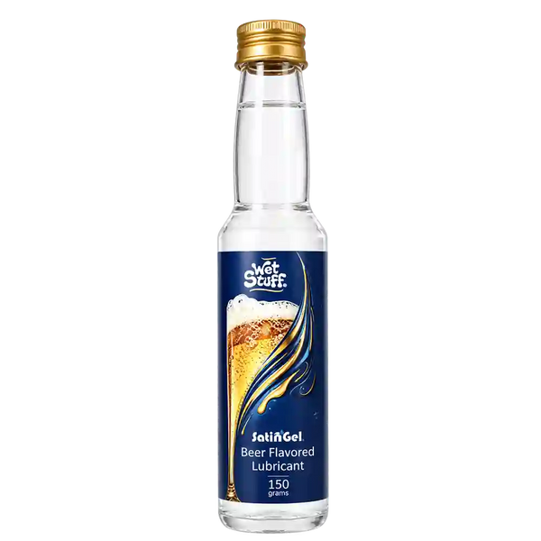 A small clear bottle of Wet Stuff Jel’Gel beer flavored lubricant with a gold cap and a dark blue label featuring a beer glass graphic, on a white background.