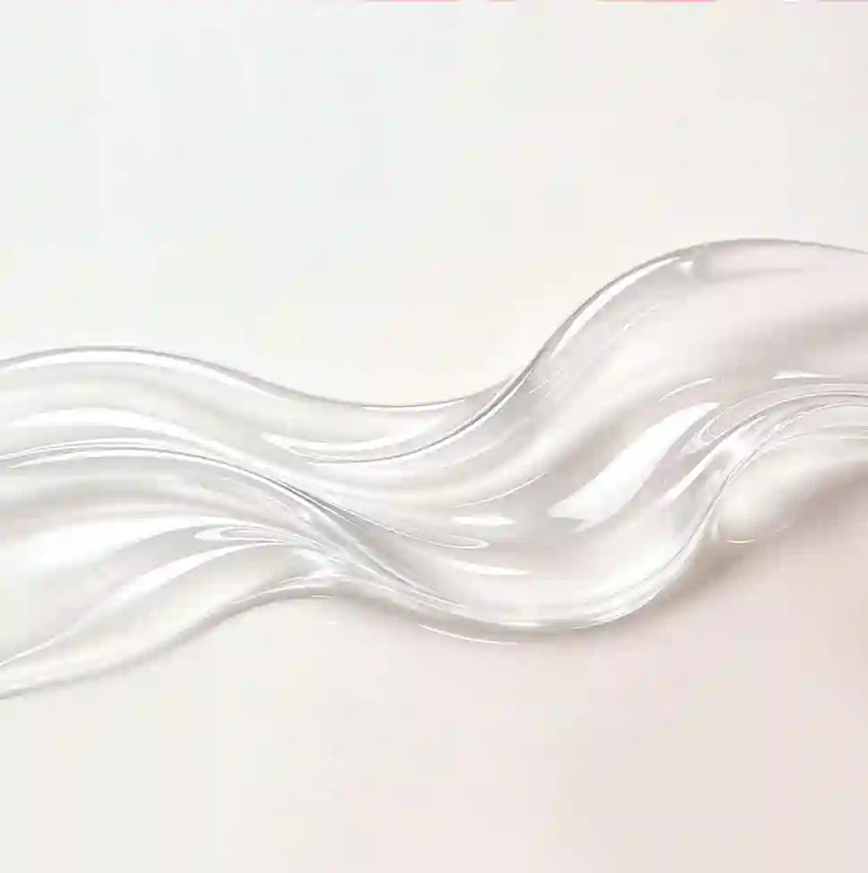 Clear, wavy glass object on a light pink background