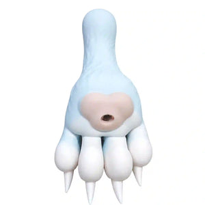 A novelty prank toy shaped like a monster claw hand sex device, featuring a pale blue body, a beige mouth opening, and white claws, isolated on a white background.