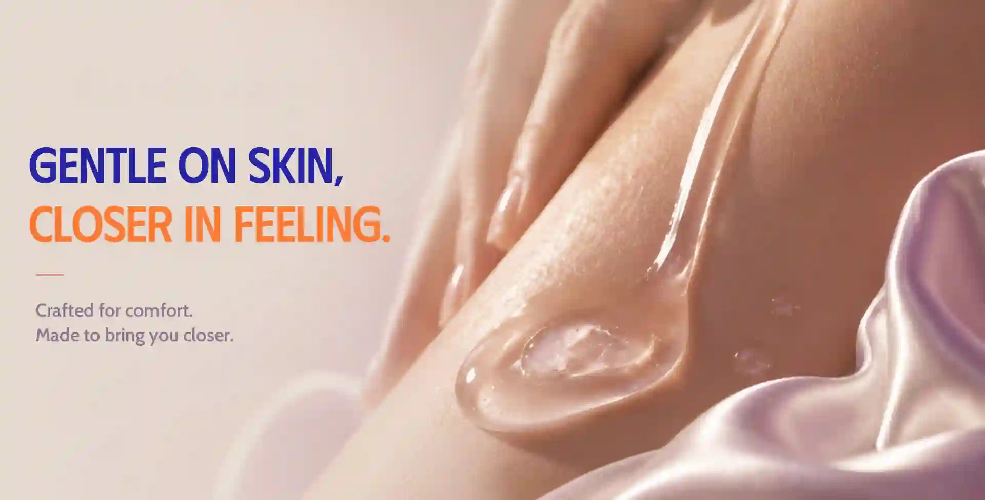Close-up of a person's leg with a glossy, transparent gel or oil being absorbed, accompanied by text that reads 'GENTLE ON SKIN, CLOSER IN FEELING.' on a soft beige background with a purple satin fabric in the corner.