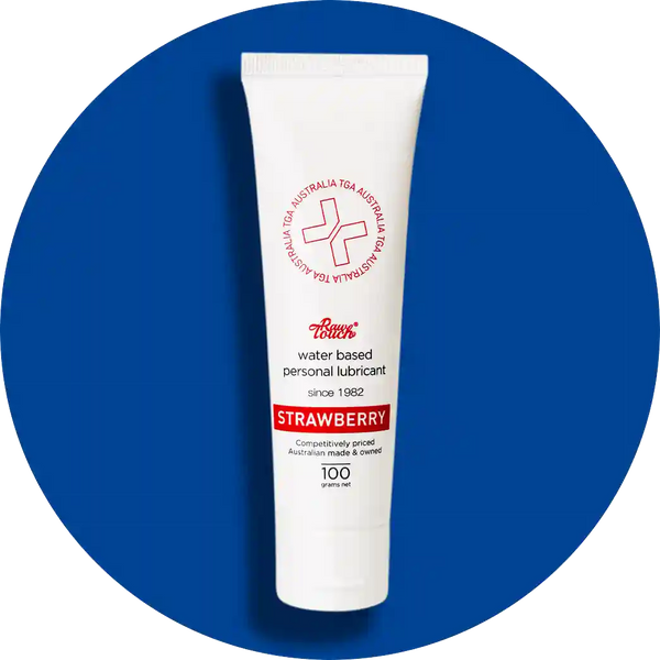 Tube of strawberry-flavored personal intercourse lubricant on a blue background