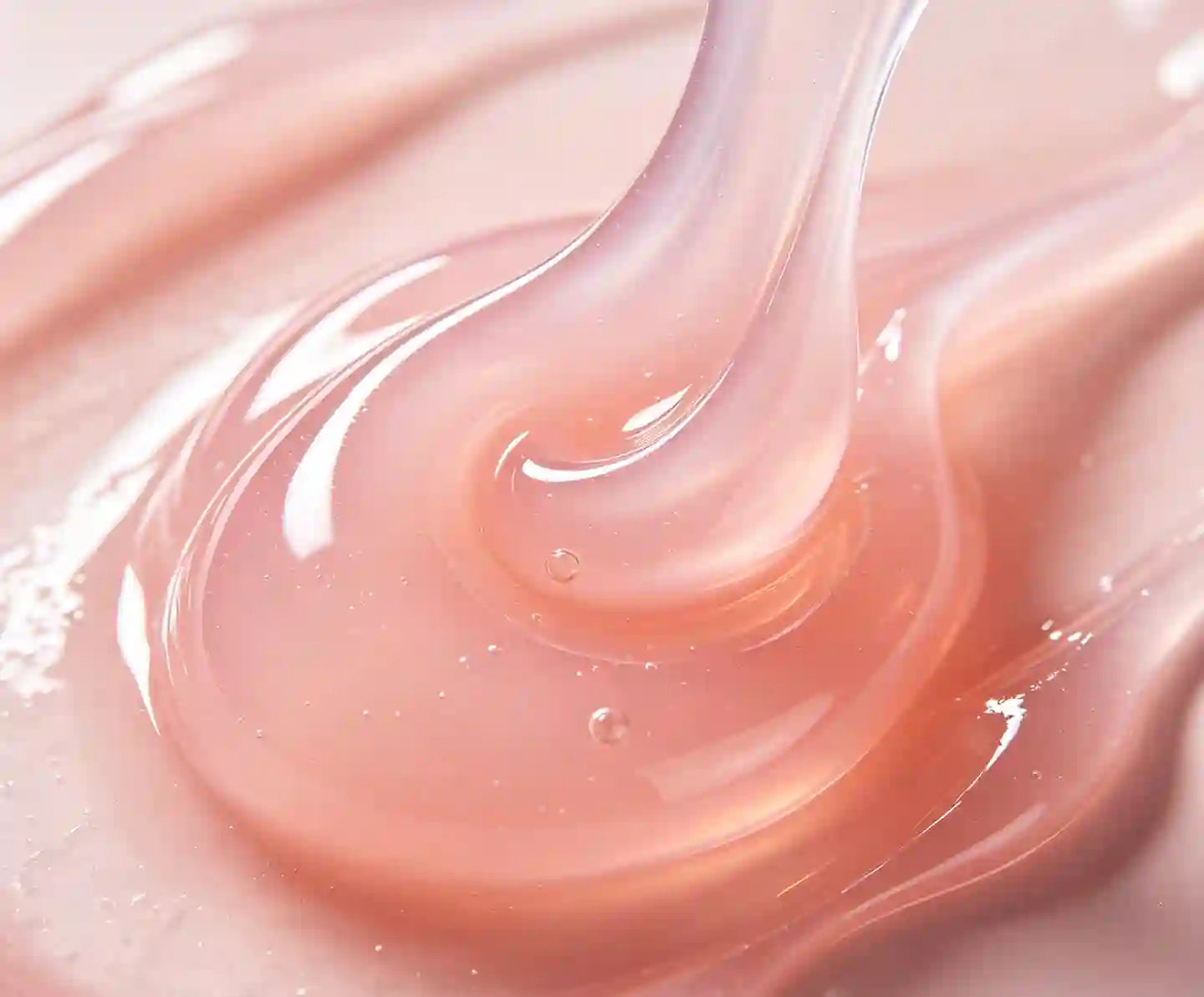 vaginal copulating use  Close-up of pink cream or lotion with a smooth texture 