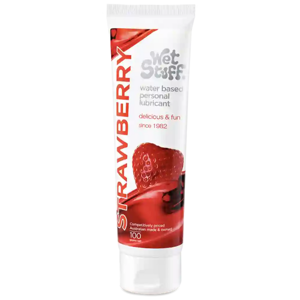 Tube of strawberry-flavored personal coupling lubricant on a white background